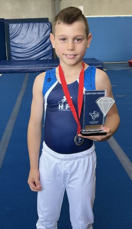 Andy Berude Gymnastics championship trophy